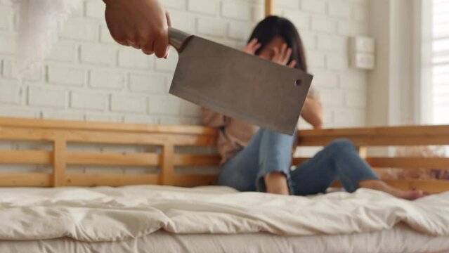 Hand holding threatening cleaver, domestic violence or abusive behavior concept footage
