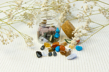 Fototapeta na wymiar Collection Of Semi-Precious Gemstones on white textured background