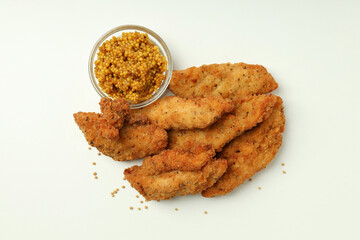 Concept of tasty food with chicken strips on white background