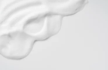 Foto op Plexiglas Skincare cleanser foam texture. Copy space and soap bubbles on white background. © m________k____
