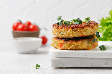 Vegan burgers, cutlets with quinoa and vegetables on marble board. Healthy food concept.