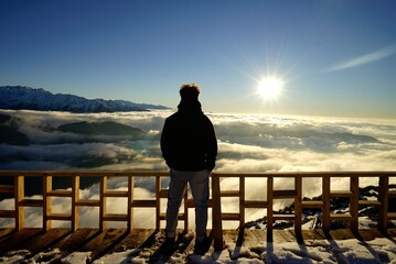 silhouette of a person on a pier