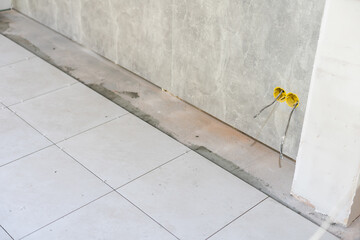 Close-up Installing tiles floor in construction work