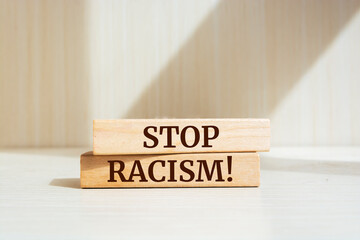 Wooden blocks with words 'Stop Racism'.