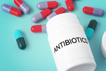 Antibiotic medicine concept on green background