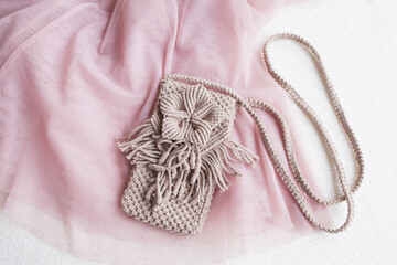 Handmade macrame phone bag. ECO friendly natural macrame cotton bag for woman. Hobby knitting handmade macrame. Modern summer concept for woman.