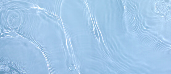 Transparent blue clear water surface texture with ripples, splashes. Abstract summer banner...