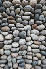 pebble stone wall texture background , vertical shot