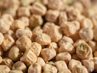 Textured dry seeds of green peas macro photo, shallow depth of field. Yellow pea seeds. Dried peas - vegetable light texture of legumes for background