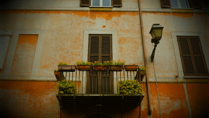 Fototapeta na wymiar Rome Italy, vintage building balcony arched window decorated