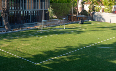 empty soccer field, empty goal, front view