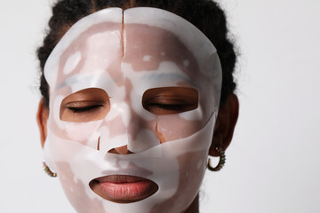 Mock-up of woman applies a hydro gel face mask. Skin care and beauty treatments