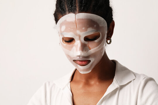 Young Woman Applies A Hydro Gel Face Mask. Skin Care And Beauty Treatments