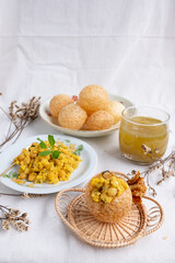 Homemade pani puri, Golgappa Indian snack on cotton calico background