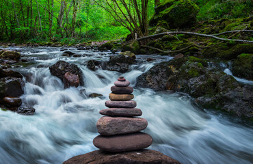 Zen stones in front of the river
