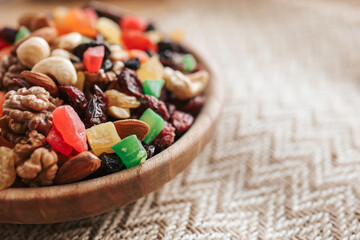 Wooden plate with dried fruits and candied fruits