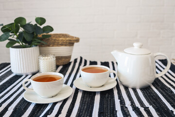 Two cups of tea, tea drinking in Scandinavian cuisine. Beautiful cozy home interior photography