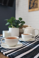 Two cups of tea, tea drinking in Scandinavian cuisine. Beautiful cozy home interior photography