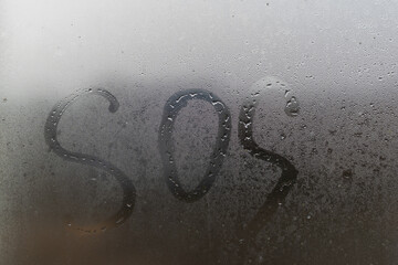 Autumn rain, the inscription on the sweaty glass - November