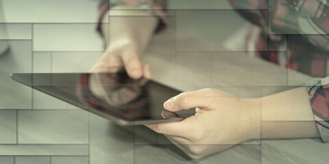 Female hands using digital tablet, geometric pattern