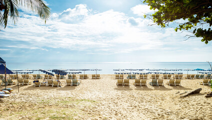 Relaxing on the beach in summer sunny day, sunbed on the beach in south of Thailand, tropical island