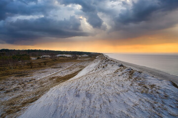 Dramatic sunset at the high dune on the darss. Beach, Baltic Sea, sky and sea.