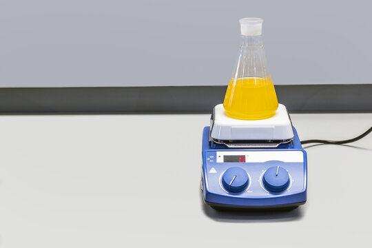 laboratory flask with liquid vibrates and is stirred in the laboratory