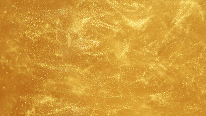 Golden glitters in water, abstract background.