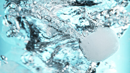 Close up of ice cubes underwater, blue background. - obrazy, fototapety, plakaty