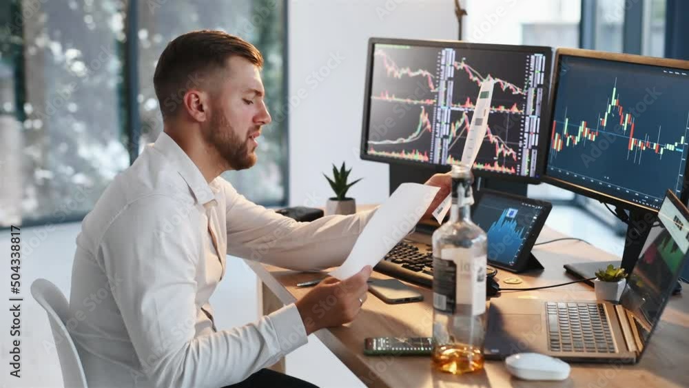 Poster using document, analyzing information. stock broker in formal clothes is working indoors in the offi