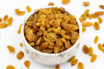 Dried raisins on a white background. Healthy and fresh.nuts. Close-up.