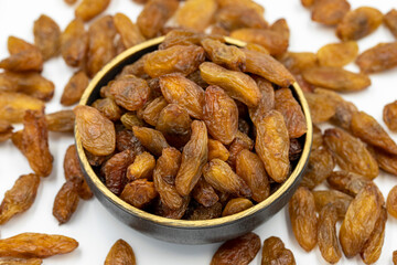 Dried raisins on a white background. Raw grapes and raisins. Healthy and fresh nuts. close-up. Local name besni uzum