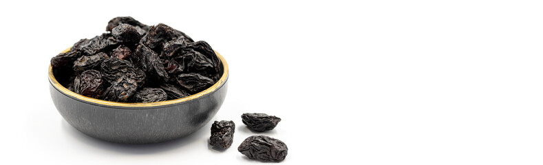 Black dried raisins on a white background. healthy and fresh.nuts. Close-up. Copy space. Space for text
