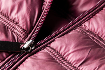 Detail of purple winter jacket, waterproof and windproof material, fabric cloth pattern