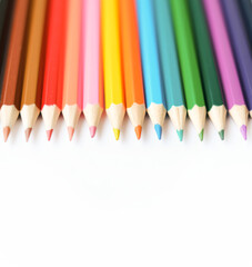 A set of colored pencils isolated on a white background in banner format. Place for text