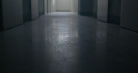 The movement of the floor in the dark corridor of the prison. A glare of light in the menacing floor, the surface. There is light at the end of the corridor. Low mental state.