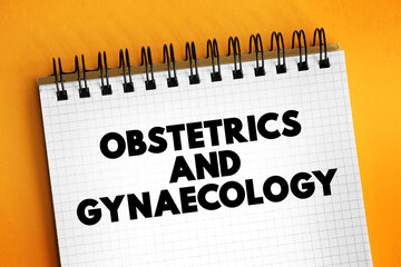 Obstetrics and gynaecology - medical specialties that focus on two different aspects of the female reproductive system, text concept on notepad