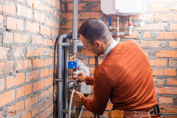 industrial heat engineer worker plumber at boiler room installation.