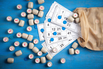 Barrels with numbers and cards for lotto table game.