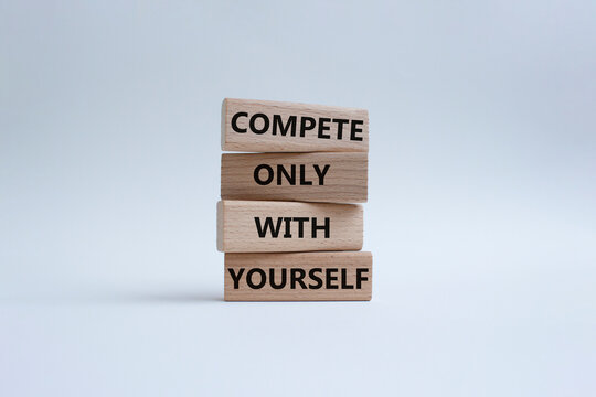 Compete only with yourself symbol. Concept words compete only with yourself on wooden blocks. Beautiful white background. Business and Compete only with yourself concept. Copy space.