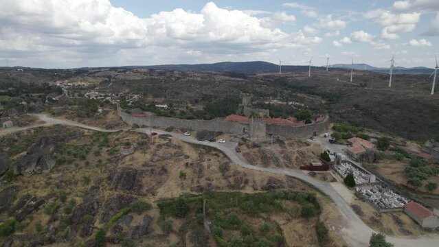 Aerial arc shows Sortelha Fortress, defensive wall and surrounding landscape