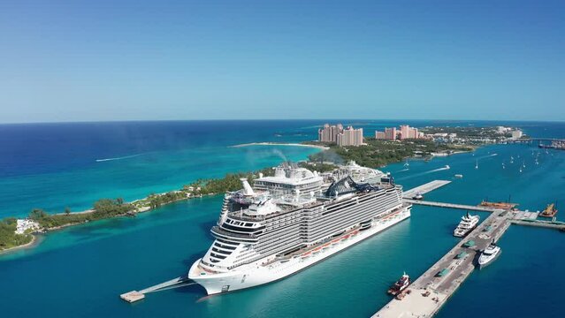 Aerial panning shot of the port of Nassau and Paradise Island with cruise ships in New Providence, The Bahamas. 4K