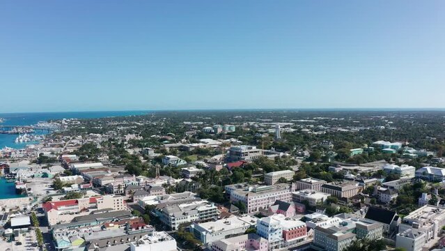 Reverse pullback aerial shot of downtown Nassau on the island of New Providence in The Bahamas. 4K