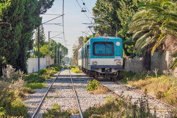 Tunisia - Tunis / Carthage - Blue train of TGM line goes between La Goulette and Carthage