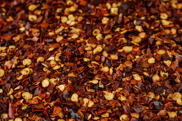 spicy chili flakes on a white background