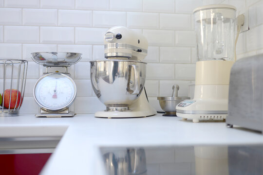 Premium Photo  Happy young couple buying expensive kitchenaid stand mixer  in appliances store.