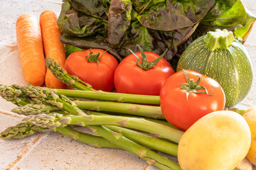 salad, tomato, carrot, potato, asparagus on a table