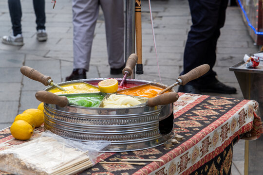 Mesir paste in a street, sweet food, Turkish culture, cuisine and street food concept, colorful yummy food, traditional mesir macunu