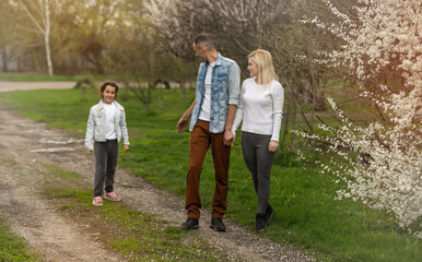 Fototapeta premium happy young family spending time outdoor