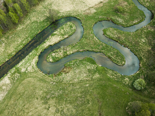 Meandering and twisting river. View from above. Ploucnice river Czech Republic